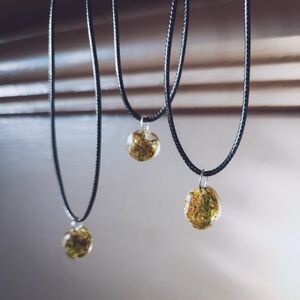 Moss in resin on black cord necklace 17inch with 2 in extender